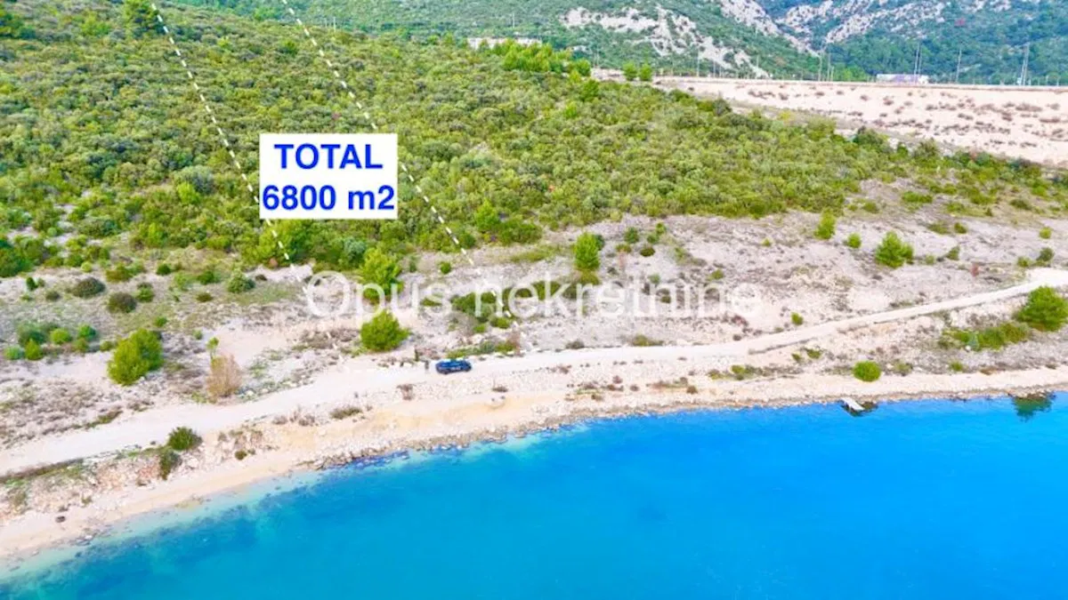 KOMARNA - poljoprivredno zemljiste 6800 m2 prvi red s pogledom na Peljeski most ( Video )