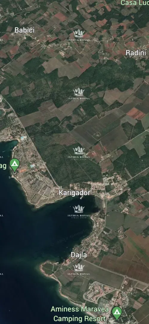 Novigrad, Karigador, sale of building land 7808m2, construction of apartments, holiday villas, 300m from the sea. – 2