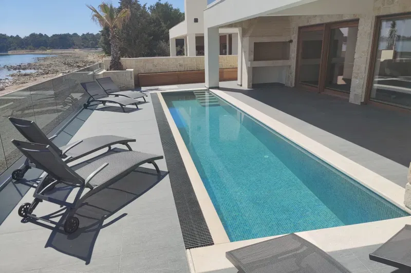 Villa with a Pool in the First Row to the Sea – 3