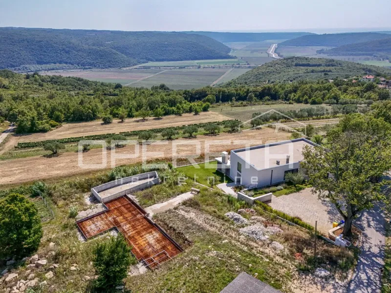 Istria, Krasica – attractive land with a project and commenced construction, sea view – 2
